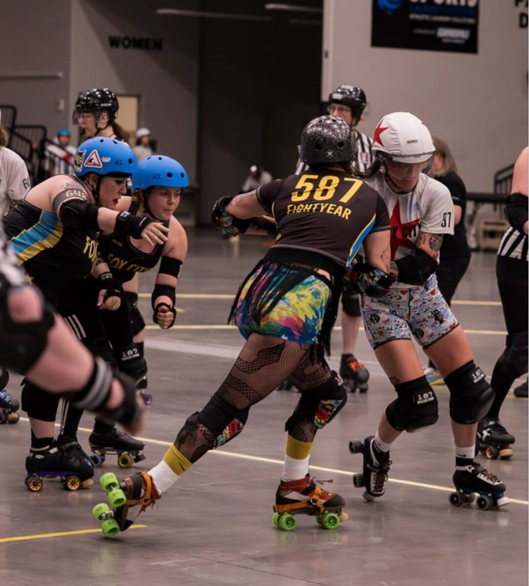 Women competing in a roller derby bout. part of Fox Cities Roller Derby